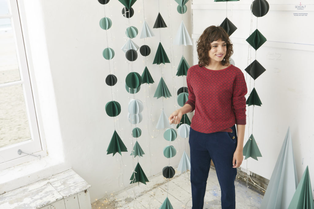Seasalt's folded Christmas decorations for 2019. Model wears the Narrator Top