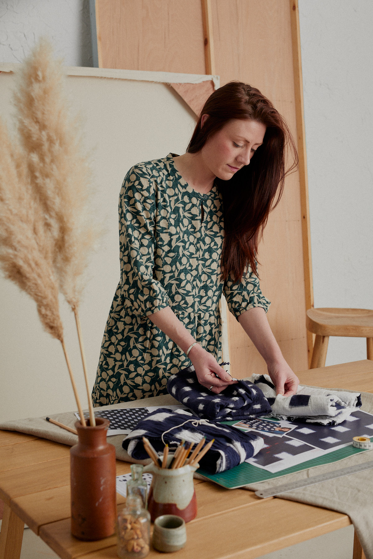 Seasalt textile designer Briony with samples of our hand dyed and woven double ikat material