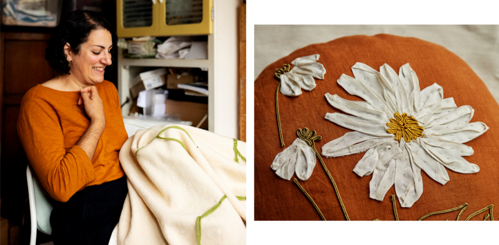 Lora stitching and a detail of her floral embroider. White daisies on orange cloth
